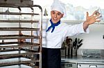 Portrait Of A Chef Moving Tray Rack Stock Photo