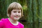 Portrait Of A Girl In Nature Stock Photo