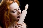 Portrait Of A Young Red-haired Woman With A Wooden Rolling Pin Stock Photo