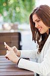 Portrait Of A Young Woman Using A Cellphone Stock Photo