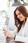 Portrait Of A Young Woman Using A Cellphone Stock Photo