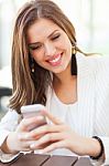 Portrait Of A Young Woman Using A Cellphone Stock Photo