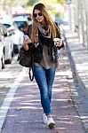 Portrait Of Beautiful Girl Drinking Coffee And Using Her Mobile Stock Photo