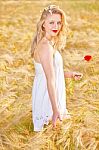 Portrait Of Beautiful Girl In Field Stock Photo