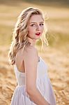 Portrait Of Beautiful Girl In Field Stock Photo