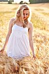 Portrait Of Beautiful Girl In Field Stock Photo