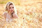 Portrait Of Beautiful Girl In Field Stock Photo