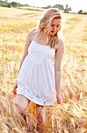 Portrait Of Beautiful Girl In Field Stock Photo