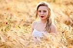 Portrait Of Beautiful Girl In Field Stock Photo