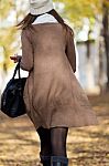 Portrait Of Beautiful Girl Walking In Autumn Stock Photo