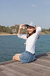 Portrait Of Beautiful Woman Happy Face Sitting On Wood Port Sea Stock Photo