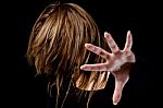 Portrait Of Female Hiding Her Face With Hair Stock Photo