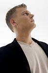 Portrait Of Handsome Man Looking Upward Stock Photo