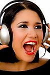 Portrait Of Happy Beautiful Female Listening Music Stock Photo