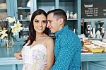 Portrait Of Happy Couple Standing In Restaurant Stock Photo