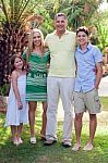 Portrait Of Happy Family, Outdoors Stock Photo