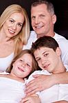 Portrait Of Happy Family Posing Towards The Camera Stock Photo