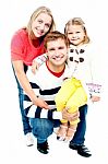 Portrait Of Happy Parents With Their Daughter Stock Photo