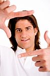 Portrait Of Man Showing Framing Hand Gesture Stock Photo