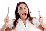 Portrait Of Shouting Woman With Fork And Knife Stock Photo