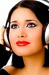 Portrait Of Smiling Beautiful Woman Listening Music Stock Photo