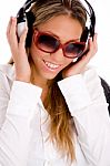 Portrait Of Smiling Female Listening Music Stock Photo