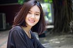 Portrait Of Thai Adult Beautiful Girl Relax And Smile Stock Photo