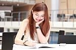 Portrait Of Thai Adult Beautiful Girl Write A Book And Smile In University Stock Photo