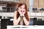 Portrait Of Thai Adult Beautiful Girl Write A Book And Smile In University Stock Photo