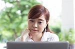 Portrait Of Thai Adult Businesswoman Beautiful Girl Using Computer Notebook Stock Photo