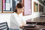 Portrait Of Thai Adult Businesswoman Beautiful Girl Using Computer Notebook Stock Photo