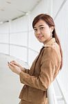 Portrait Of Thai Adult Businesswoman Beautiful Girl Using Her Smart Phone Stock Photo