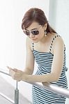 Portrait Of Thai Adult Businesswoman Beautiful Girl Using Her Smart Phone Stock Photo