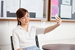 Portrait Of Thai Adult Businesswoman Beautiful Girl Using Her Smart Phone Selfie Stock Photo