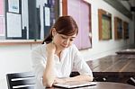 Portrait Of Thai Adult Businesswoman Beautiful Girl Using Her Tablet Stock Photo