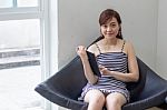 Portrait Of Thai Adult Businesswoman Beautiful Girl Using Her Tablet Stock Photo