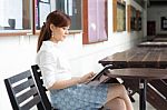 Portrait Of Thai Adult Businesswoman Beautiful Girl Using Her Tablet Stock Photo