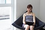 Portrait Of Thai Adult Businesswoman Beautiful Girl Using Her Tablet Stock Photo