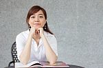 Portrait Of Thai Adult Businesswoman Beautiful Girl Write A Book Stock Photo