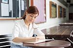 Portrait Of Thai Adult Businesswoman Beautiful Girl Write A Book Stock Photo