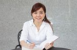 Portrait Of Thai Adult Businesswoman Beautiful Girl Write A Book Stock Photo