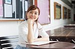 Portrait Of Thai Adult Businesswoman Beautiful Girl Write A Book Stock Photo