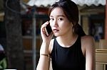 Portrait Of Thai Adult Student University Beautiful Girl Calling Smart Phone Stock Photo