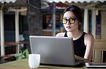 Portrait Of Thai Adult Student University Beautiful Girl Using Her Laptop Stock Photo