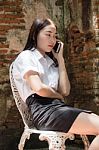 Portrait Of Thai Adult Student University Beautiful Girl Using Her Smart Phone Stock Photo