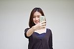 Portrait Of Thai Adult Student University Beautiful Girl Using Her Smart Phone Selfie Stock Photo