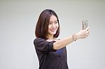 Portrait Of Thai Adult Student University Beautiful Girl Using Her Smart Phone Selfie Stock Photo