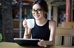 Portrait Of Thai Adult Student University Beautiful Girl Using Her Tablet Stock Photo