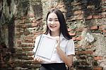 Portrait Of Thai Adult Student University Beautiful Girl Using Her Tablet Stock Photo