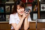 Portrait Of Thai Adult Student University Uniform Beautiful Drinking Coffee Stock Photo